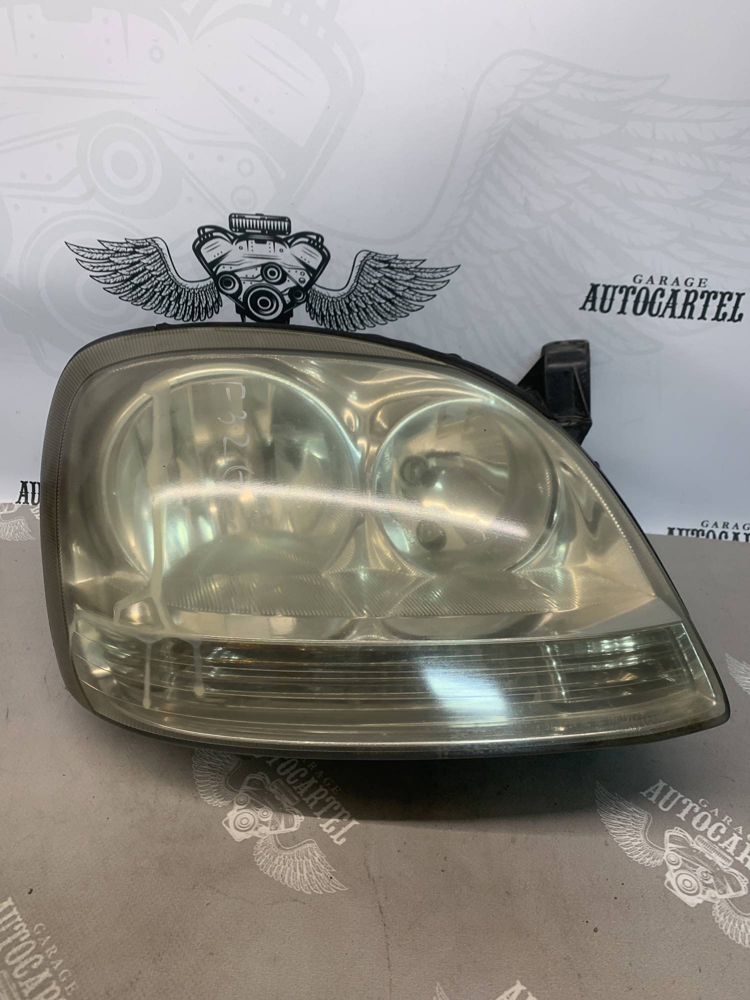 Фара передня права Nissan Almera Tino 1998-2006 під поліровку 964324