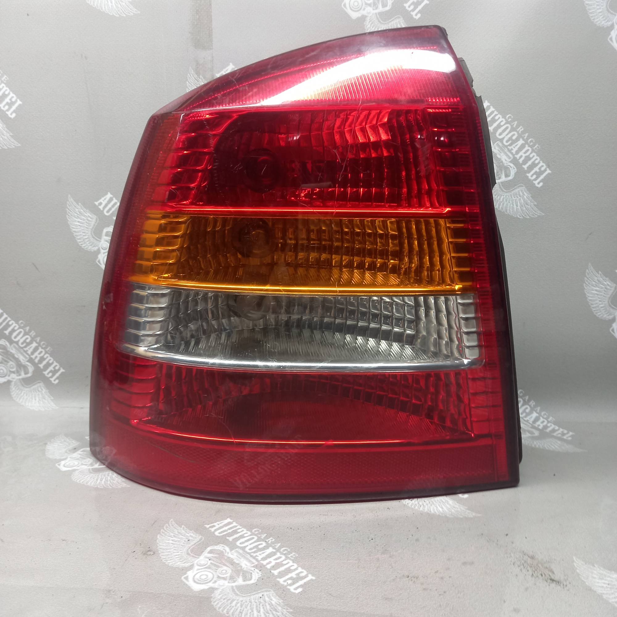 Ліхтар задній лівий Opel Astra G купе хетчбек 90521542